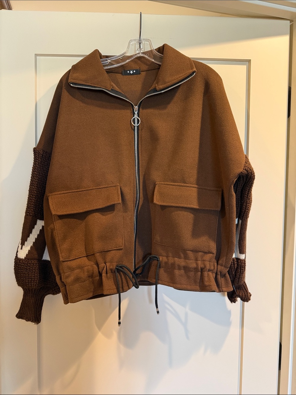 Brown jacket with knit sleeves purchased at a boutique